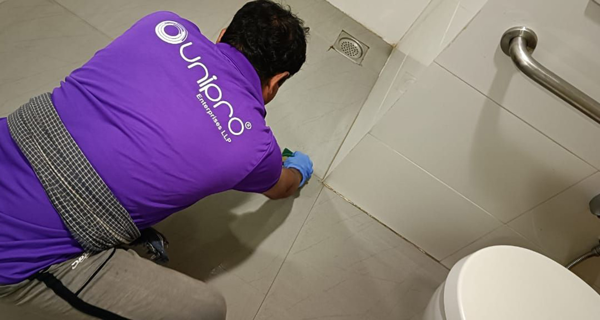 UniPro Team doing antislip treatment on a tiled toilet floor